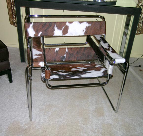 chrome tubular steel frame chair with brown, white and black cowhide upholstery
