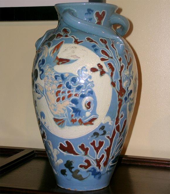 Large British Arts and Crafts ovoid vase with incised fish on turquoise  Glazed ground.  Three twisted handles near top.