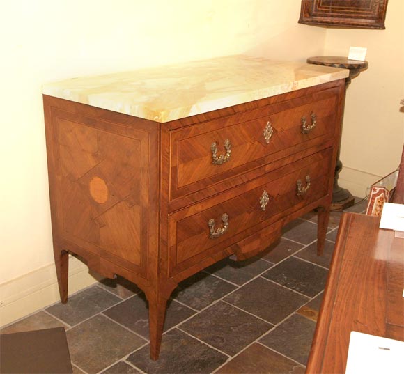 Northern Italian marquetry walnut commode in the neoclassical taste with conforming sienna marble top.
