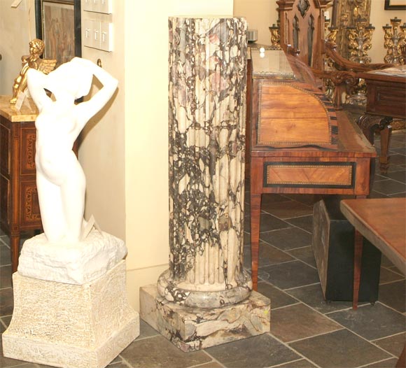Carved marble column, together with faux marble column