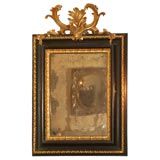 Italian black painted and parcel-gilt mirror