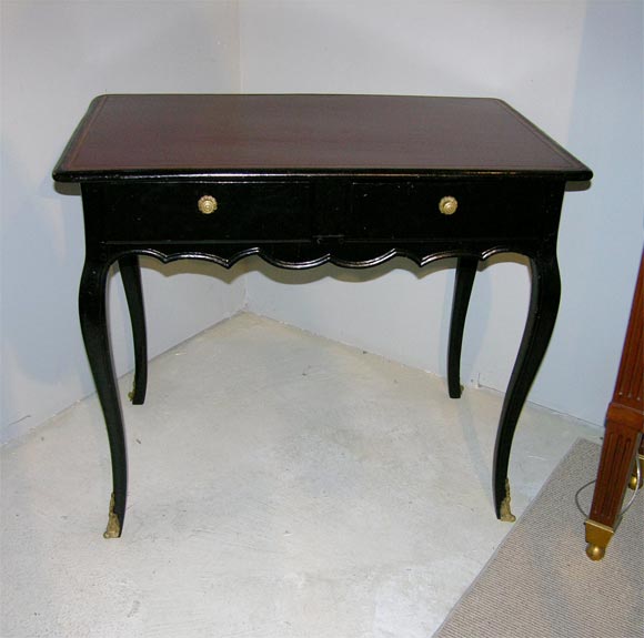 A 19thc. Louis XV style ebonized small writing desk.