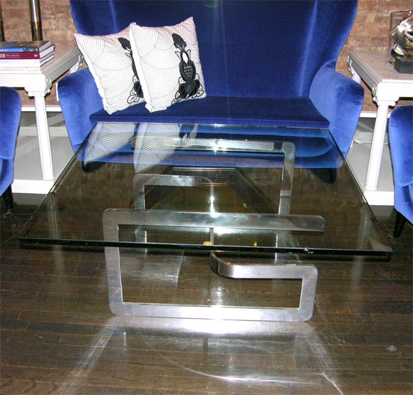 a beautiful and rare coffee table by Gucci, circa 1970, solid plate steel nickeled finish and large thick glass top. a true find