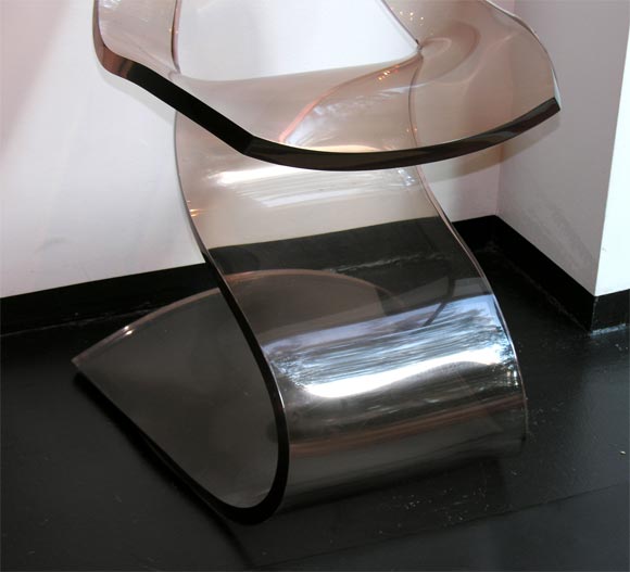 Sensuous, sinuous chair or sculpture designed in 1971, using a single piece of smoke-tinted clear acrylic. Perfection to the last detail, one inch thickness throughout with no seams. This chair is surprisingly comfortable, yet it stands on its own