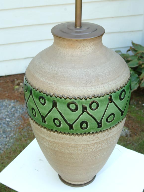 Natural pottery with a glazed decorative band.