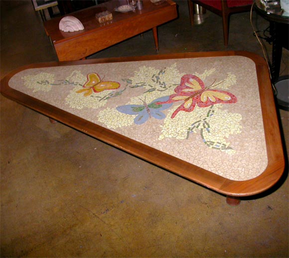 Exquisite butterflies mosaic pattern on a boomerang shaped coffee table.