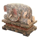 A Hand Painted Wood Elephant on a Stand