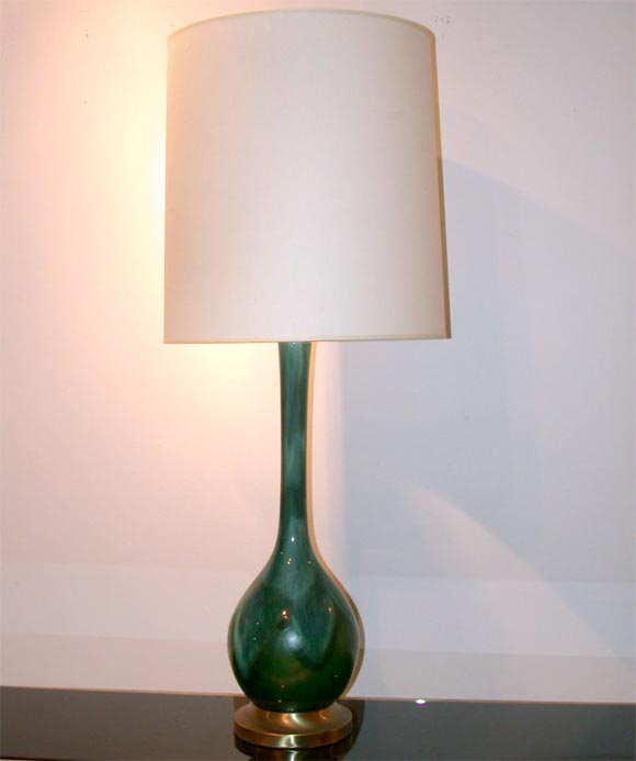 Large pair of ceramic lamps by Haeger with a beautiful peacock glaze and ivory paper shades.
