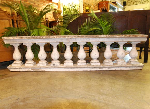 Wooden balustrade with appealing white paint.  10 balustres-could be made into smaller tables.  We also have more if you are interested.