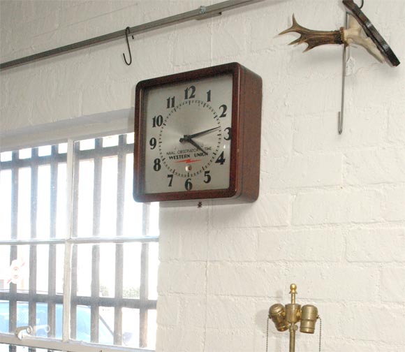Wooden cased Western Union wall clock with the usual electric movement that was checked daily for time keeping accuracy with National Observatory Time. This clock now runs on a 6 volt battery. The pendulum is adjustable for time keeping accuracy.