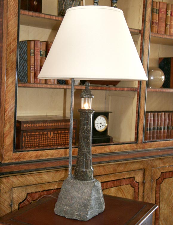 A serpentine lighthouse lamp with custom shade.