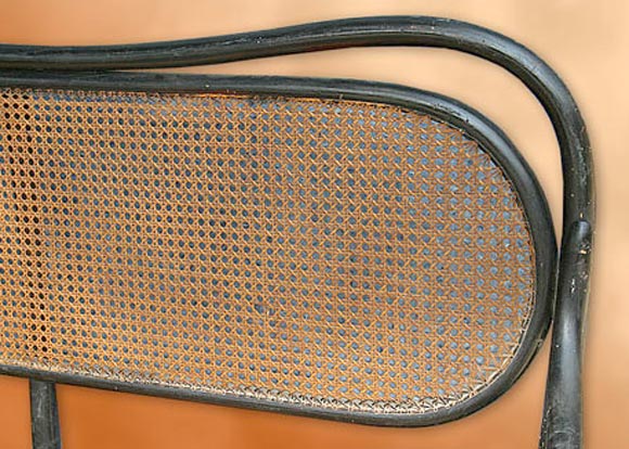 BLACK PAINTED THONET CANOPE WITH A CANED SEAT