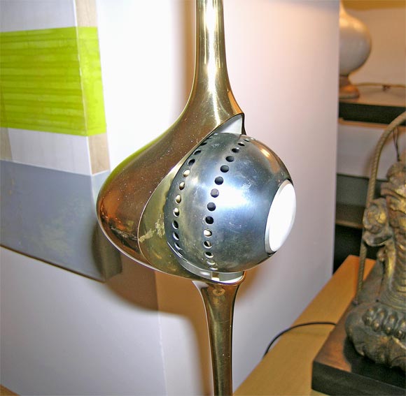 A rare, original Arredoluce eyeball lamp, brass body with a grey metal eyeball, mounted on a white enameled base.