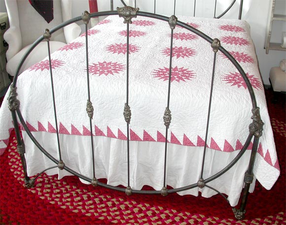 A 1890's Victorian cast iron bed, called the 