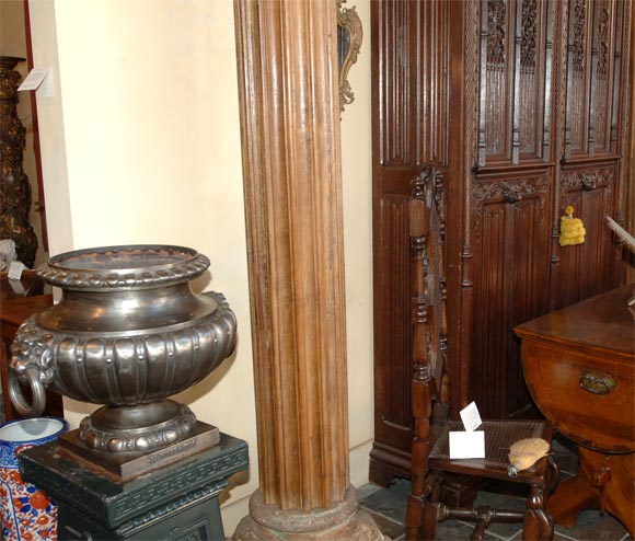 Pair of French neoclassical polished cast iron garden urns