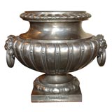 Pair of French neoclassical polished cast iron garden urns