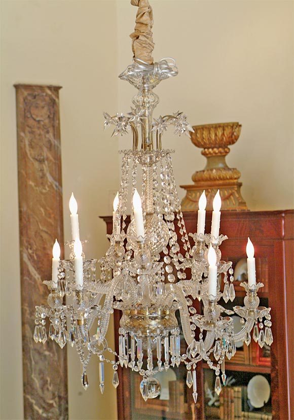 Grand Scale Mid 19th Century Venetian 10-Light Chandelier with Scrolling Rope Twist Arms culminating in Lattice Cut Orbs; the Top featuring Starbursts connected by Hand Cut Crystal Swags and the Whole with Pie Crust Edges. Circa 1850.