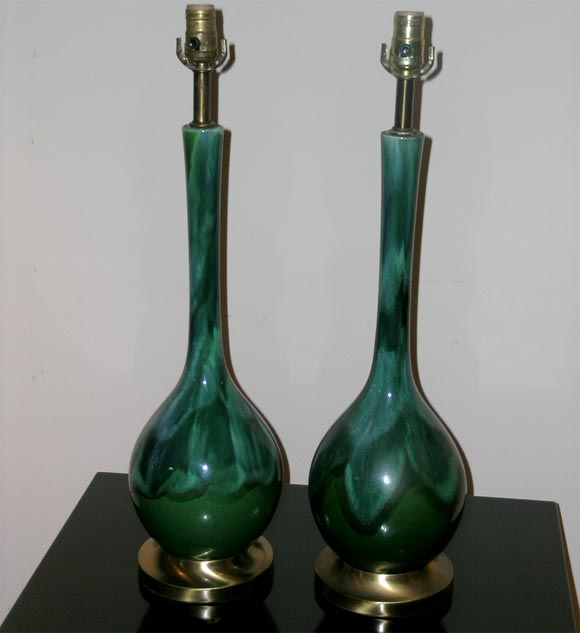 PAIR OF CERAMIC LAMPS WITH A PEACOCK DRIP GLAZE.