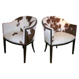 PAIR OF BEAUTIFUL ARCHED BACK CHAIRS UPHOLSTERED IN COWHIDE