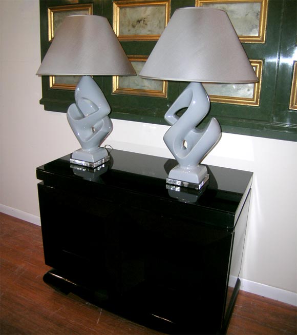 PAIR OF GRAY CERAMIC SYMBOL LAMPS WITH MATCHING SHADES.
