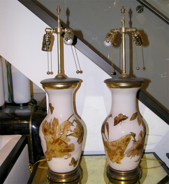 Pair of glass vase-form table lamps with butterfly and floral decoupage elements.<br />
<br />
<br />
View our complete collection at www.johnsalibello.com