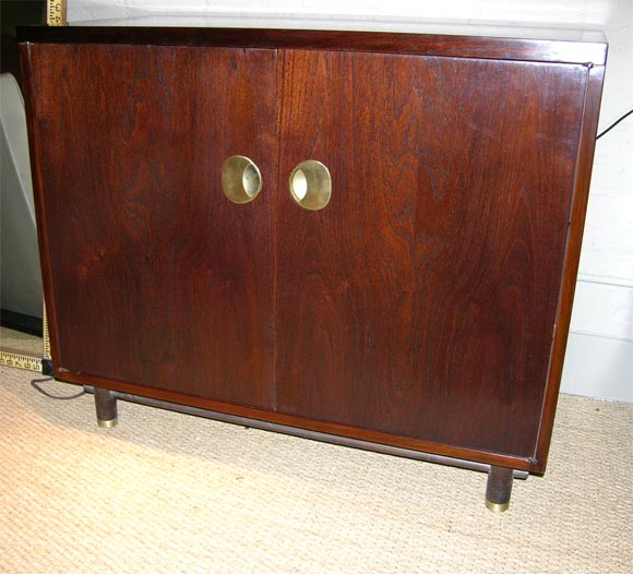 Walnut cabinet with round hardware