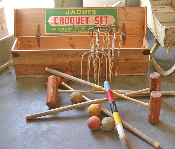 Large croquet set with original storage box.  Specially made for Harrod's is stamped on outside of box.