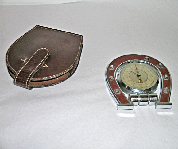 Folding horse shoe clock with orignal case