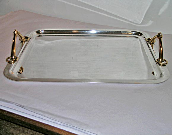 Large chrome Hermes serving tray with gold plate horse bit handles