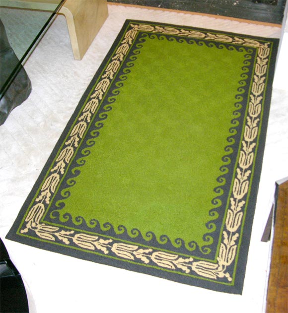Hand made wool carpet in green with brown and beige decorative border design.  Selected by Billy Haines for the Lasker residence in Los Angeles.