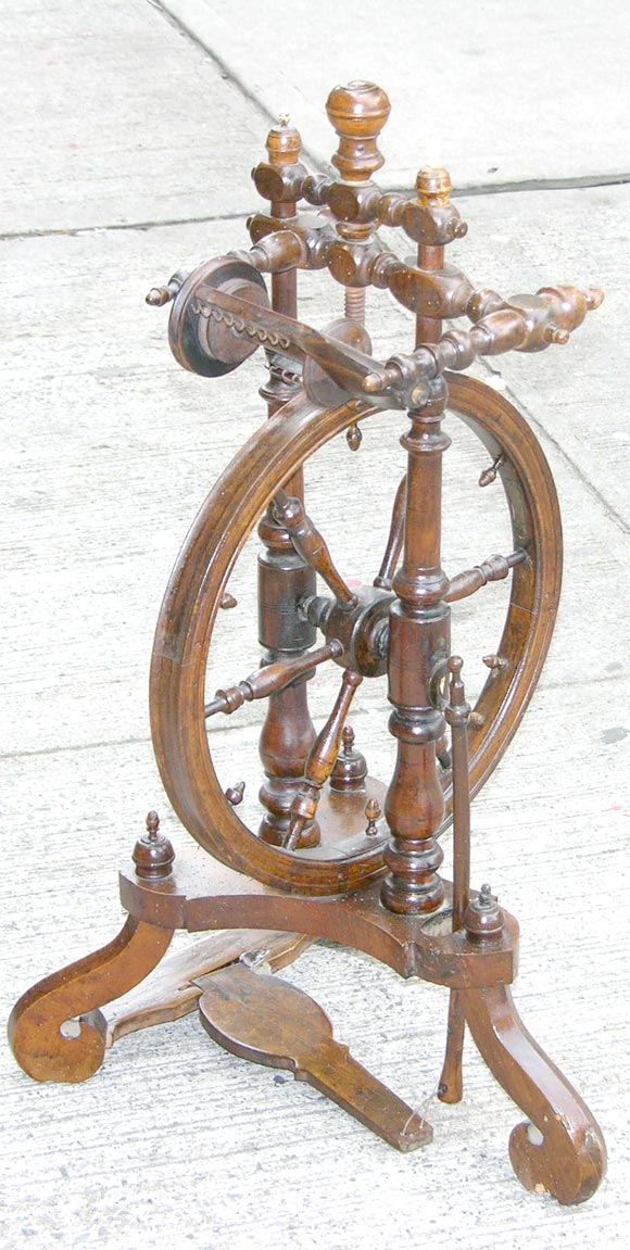 A fine and unusual antique continental walnut spinning wheel