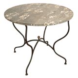 Marble table with an iron base with brass ball