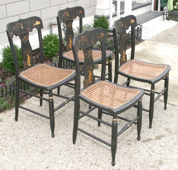 A charming set of fancy side chairs with raised gesso and painted chinoiserie decoration.