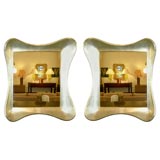 Pair of amorphic shaped wall mirrors