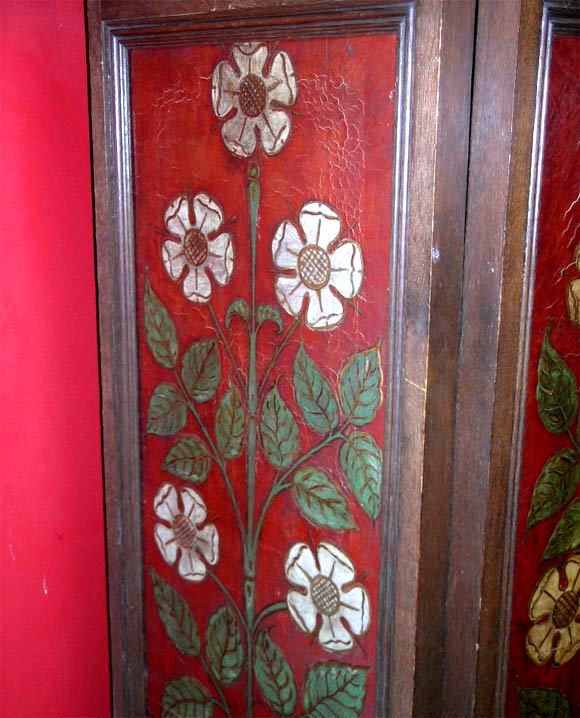 An unusal English Arts and Crafts period Regimental embossed and painted leather four fold screen in an oak frame - note colour is off in these photos, the red is a much richer and muted burgandy.<br />
The screen carries the Emblem of the Order of