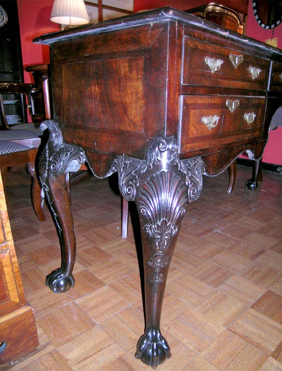 Irish mahogany sideboard with five drawers on cabriole legs ending in ball and claw feet, crossbanding through out.