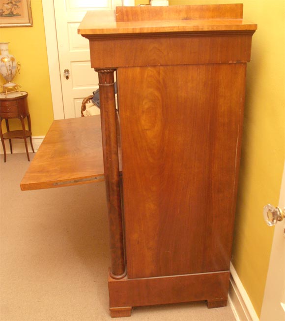 Mahogany secretary abattant, the fall front opening to a fitted interior with small drawers and compartments.  Classical style with pedimented top and columns on either side.