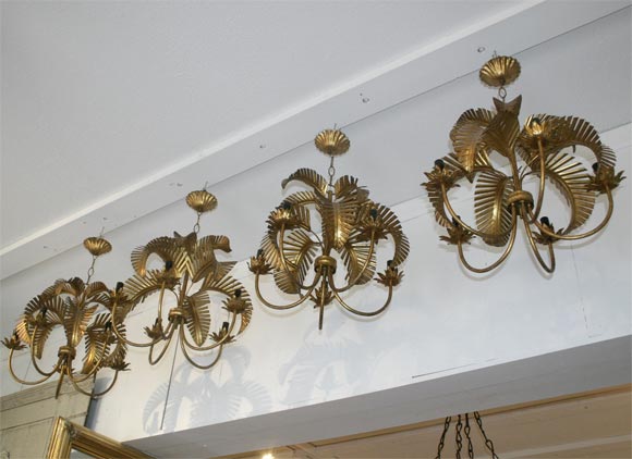 Four metal palm chandeliers