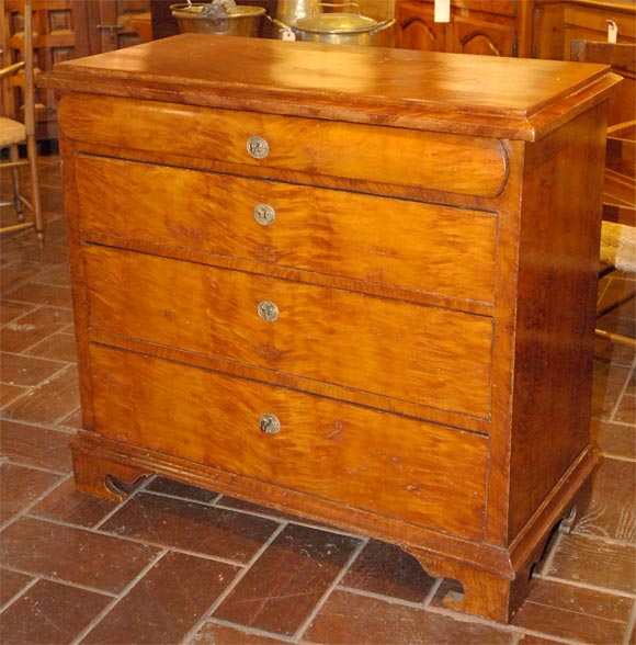 4 drawer faux painted chest of drawers with bracket feet and top with molded edge.