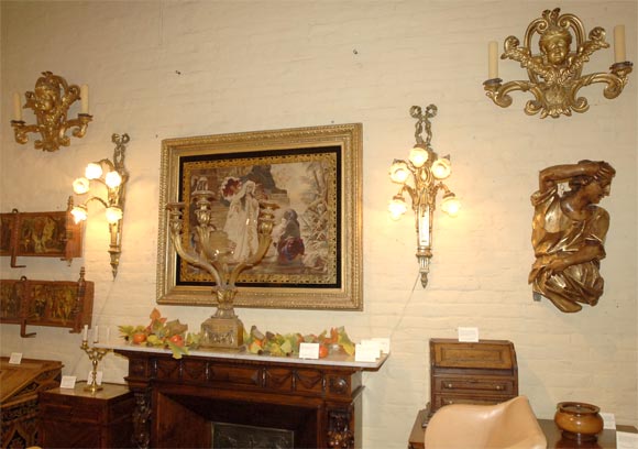 Pair of Italian giltwood cherub sconces