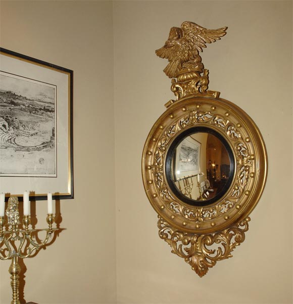 Regency carved convex bull's-eye mirror