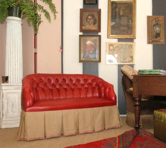 A Tufted Red Leather Settee With a Belgian Linen Skirt