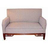 settee with adjustable arm