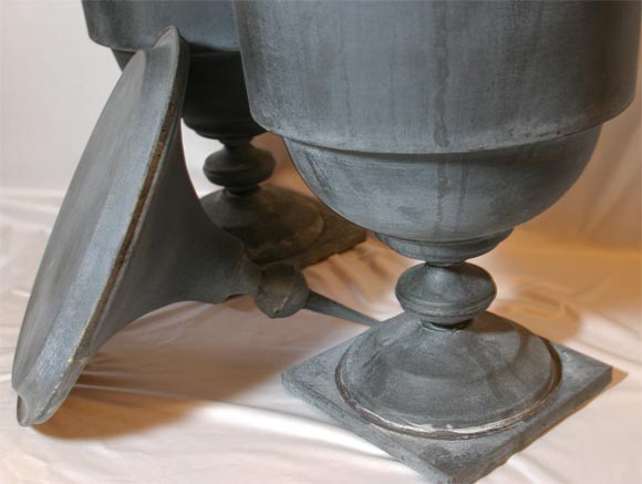 PAIR OF ZINC LIDDED URNS 4