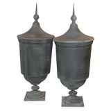 PAIR OF ZINC LIDDED URNS