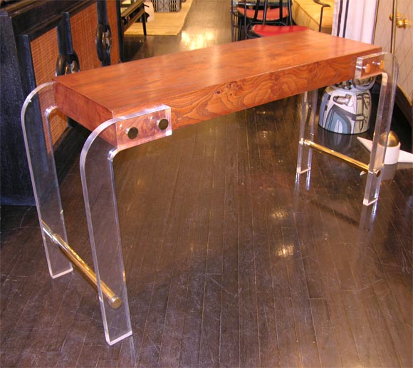 Wood top and lucite legs console, with beautiful brass accents.