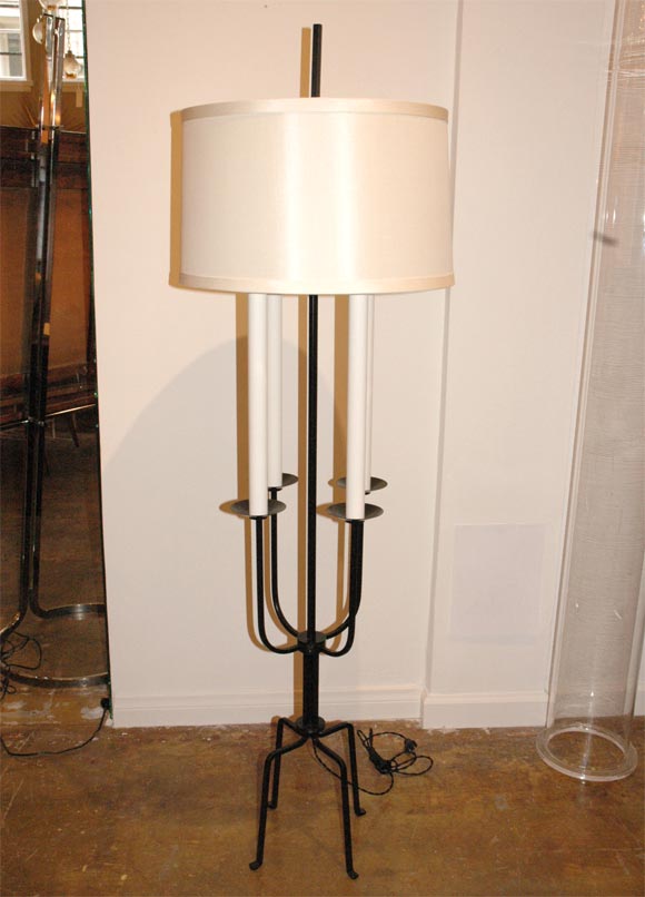 Parzinger iron floor lamp, metal candle covers.

Rewired with twist cord shade $250.00.