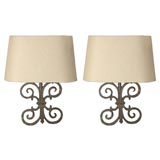 Pair of iron sconces made from architectural parts Pair of iron sconces made from architectural parts