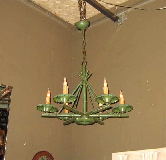 Green metal chandelier in the style of Jacques Adnet. Six arms imitating bamboo and painted green.