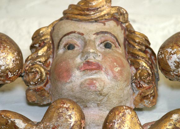 Italian carved,  painted and giltwood cherub 1